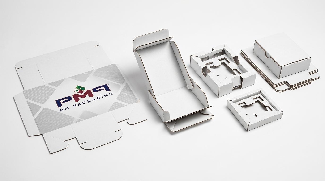 Custom die-cut SFL packaging blanks showing crease score lines, fold relief notches, and internal partition inserts