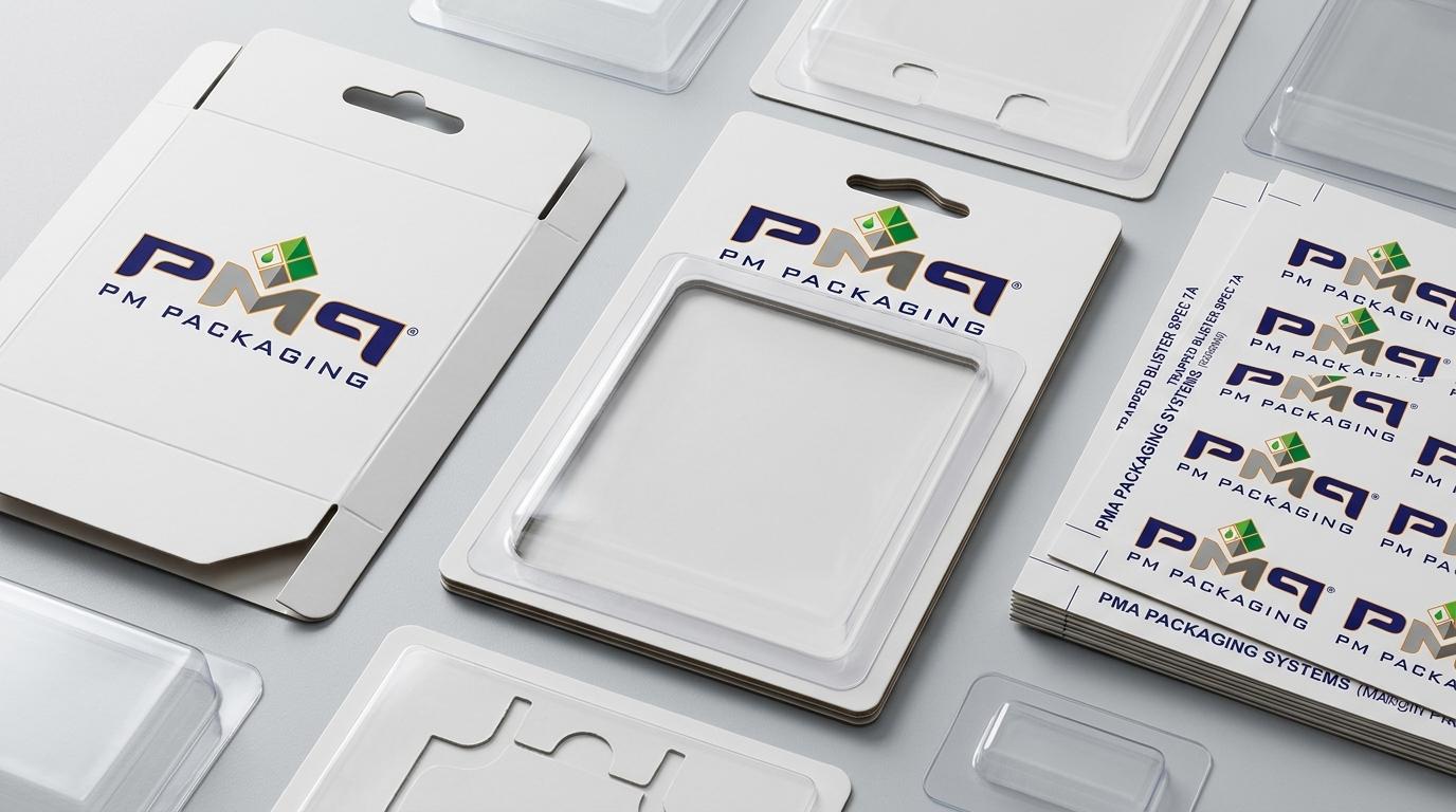 Precision-engineered paperboard blister card structural components, trapped blister assemblies, and Euro-slot hang tabs with PM Packaging logo